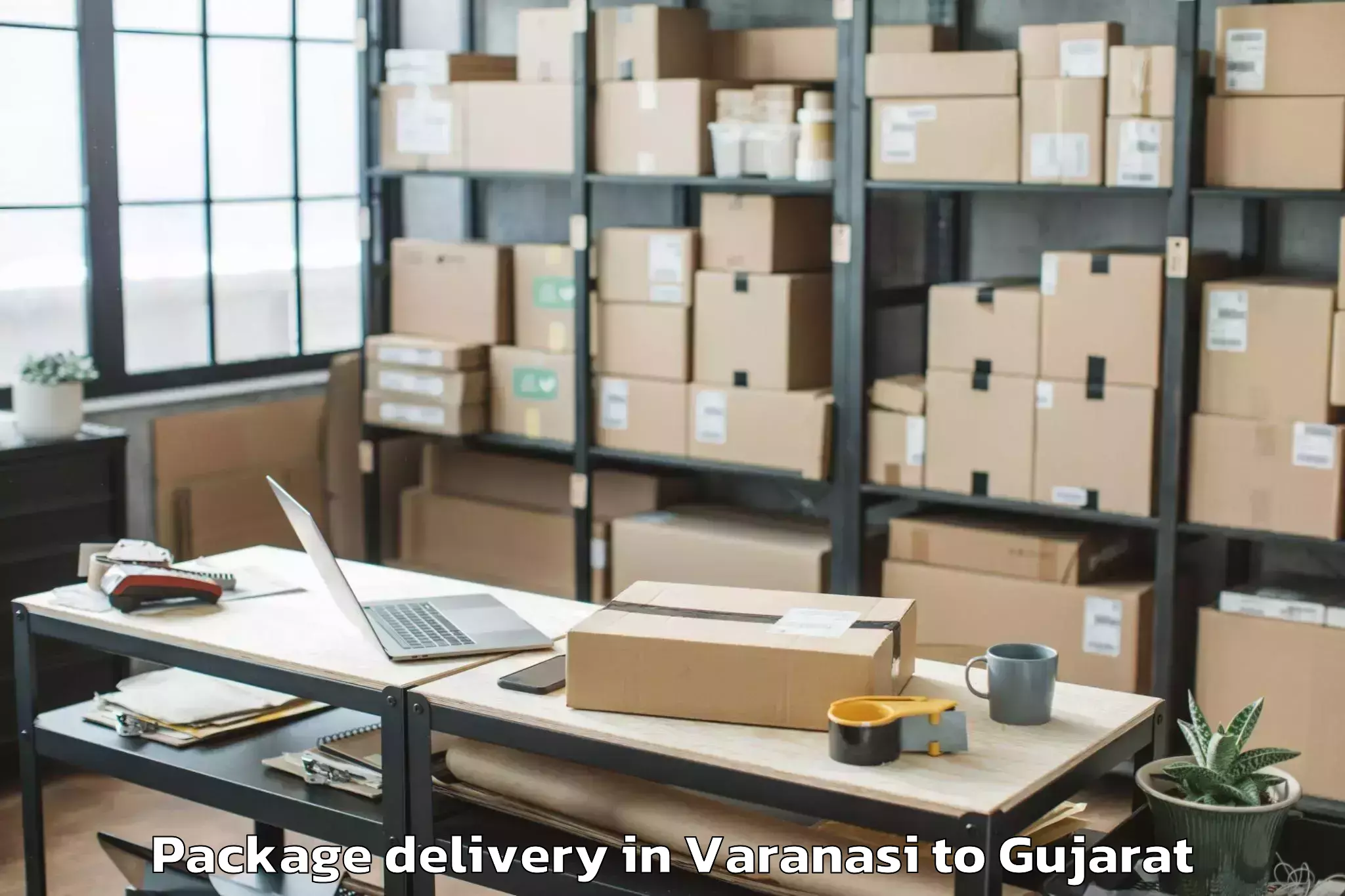 Book Varanasi to Ganpat University Mehsana Package Delivery Online